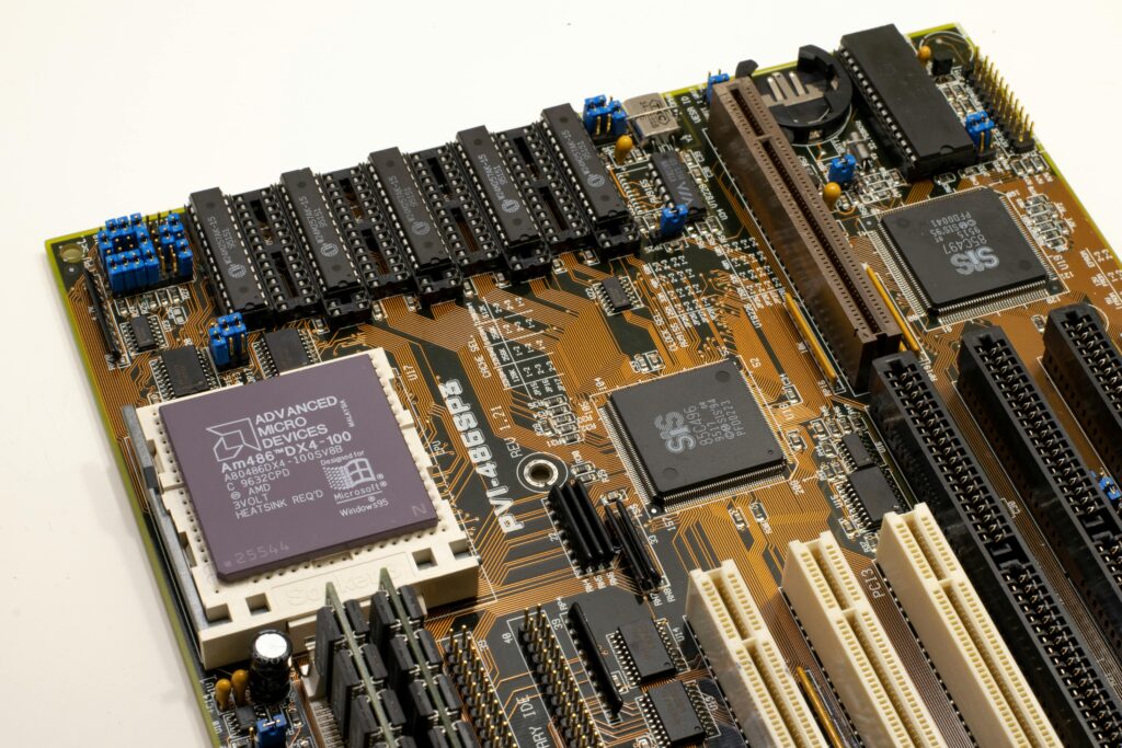 A detailed close-up of a vintage motherboard highlighting microprocessor and electronics components.