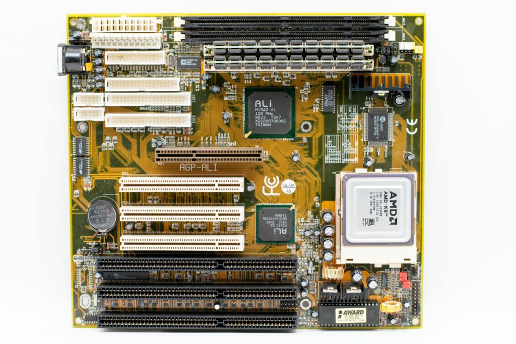 High-angle view of a vintage AMD motherboard showcasing PCI and AGP slots.
